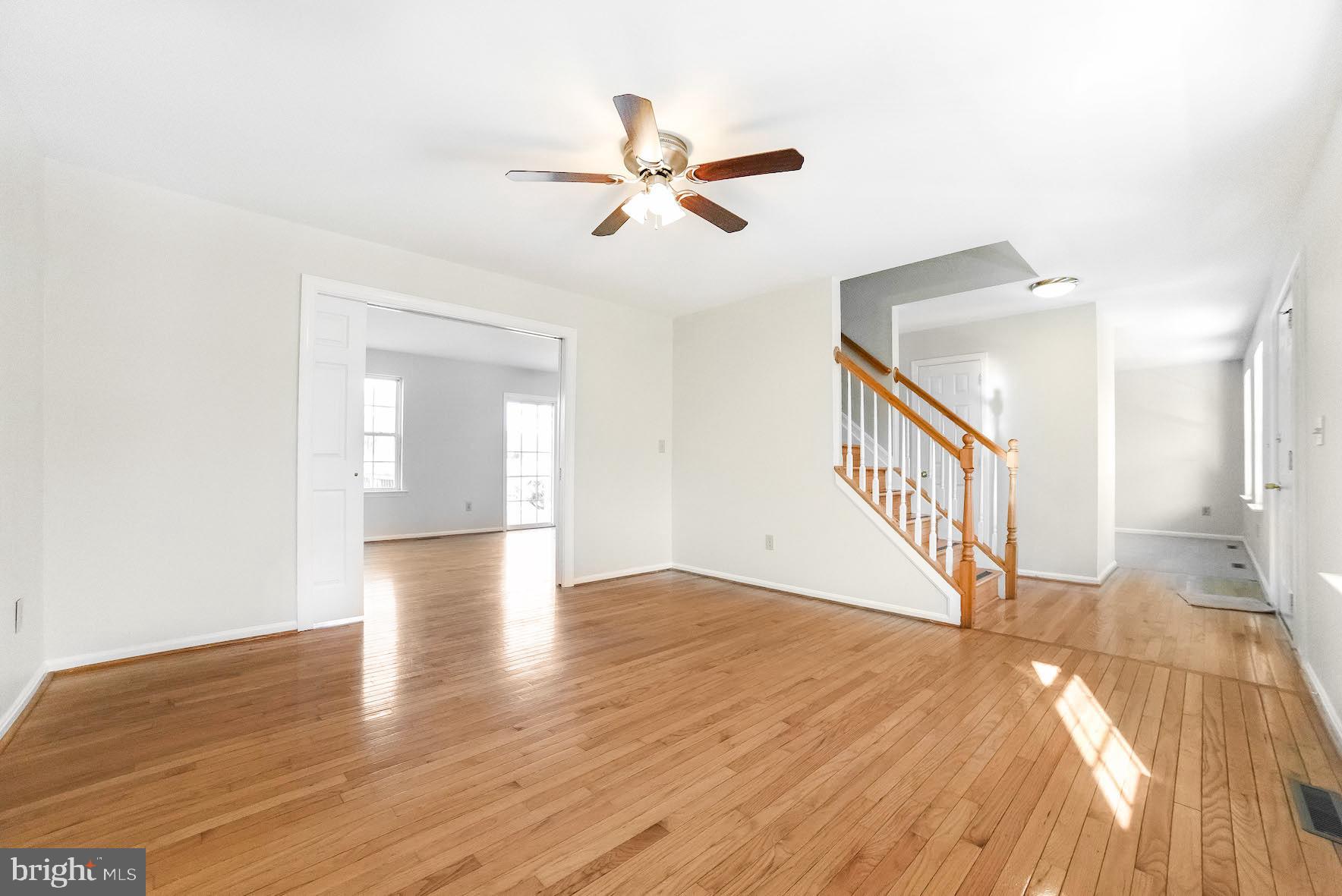 11211 Rawhide Road Lusby, MD 20657 - Photo 3 of 40 Living room with pocket doors to family room