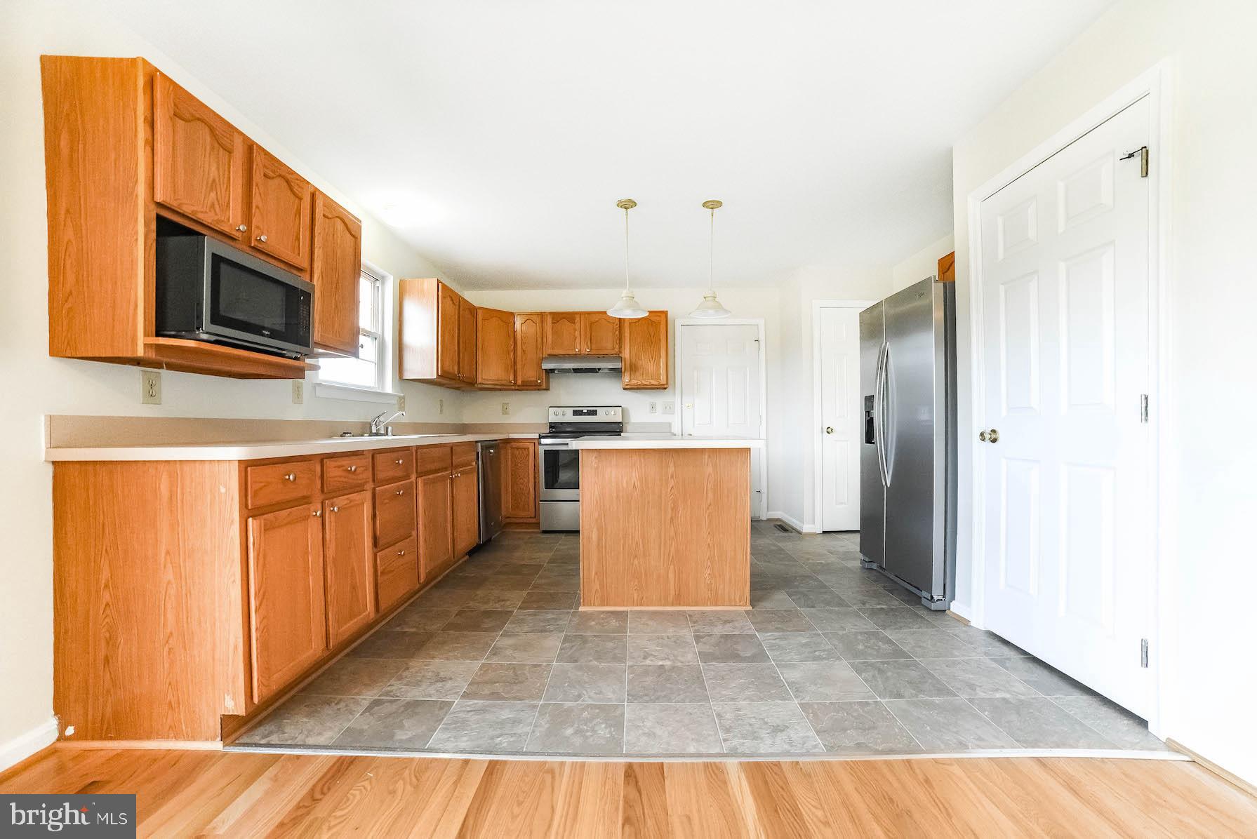 11211 Rawhide Road Lusby, MD 20657 - Photo 21 of 40 Kitchen w/pendant lighting over island
