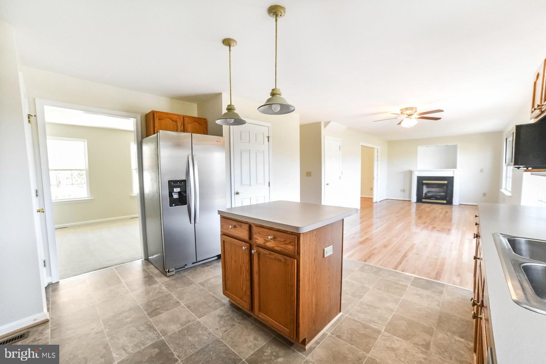 11211 Rawhide Road Lusby, MD 20657 - Photo 23 of 40 Island for extra prep space and storage