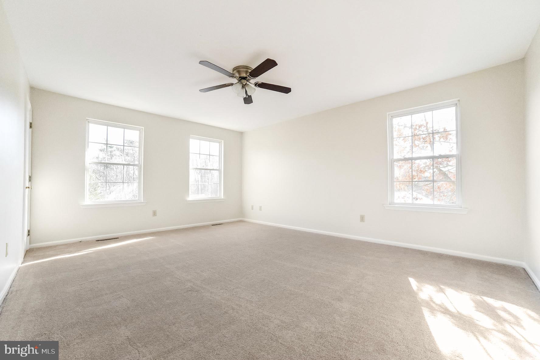 11211 Rawhide Road Lusby, MD 20657 - Photo 9 of 40 Big Master with ceiling fan, walk-in closet