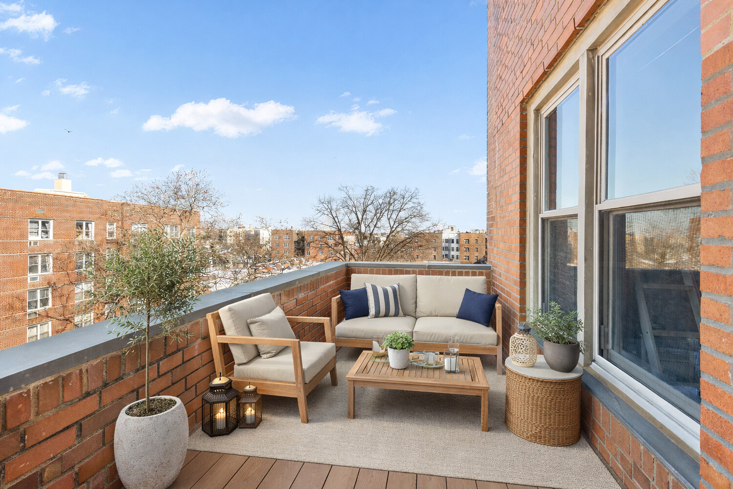 9425 Shore Road, Unit 6C Brooklyn, NY 11209 - Photo 8 of 9 a balcony with couple of couches and potted plants