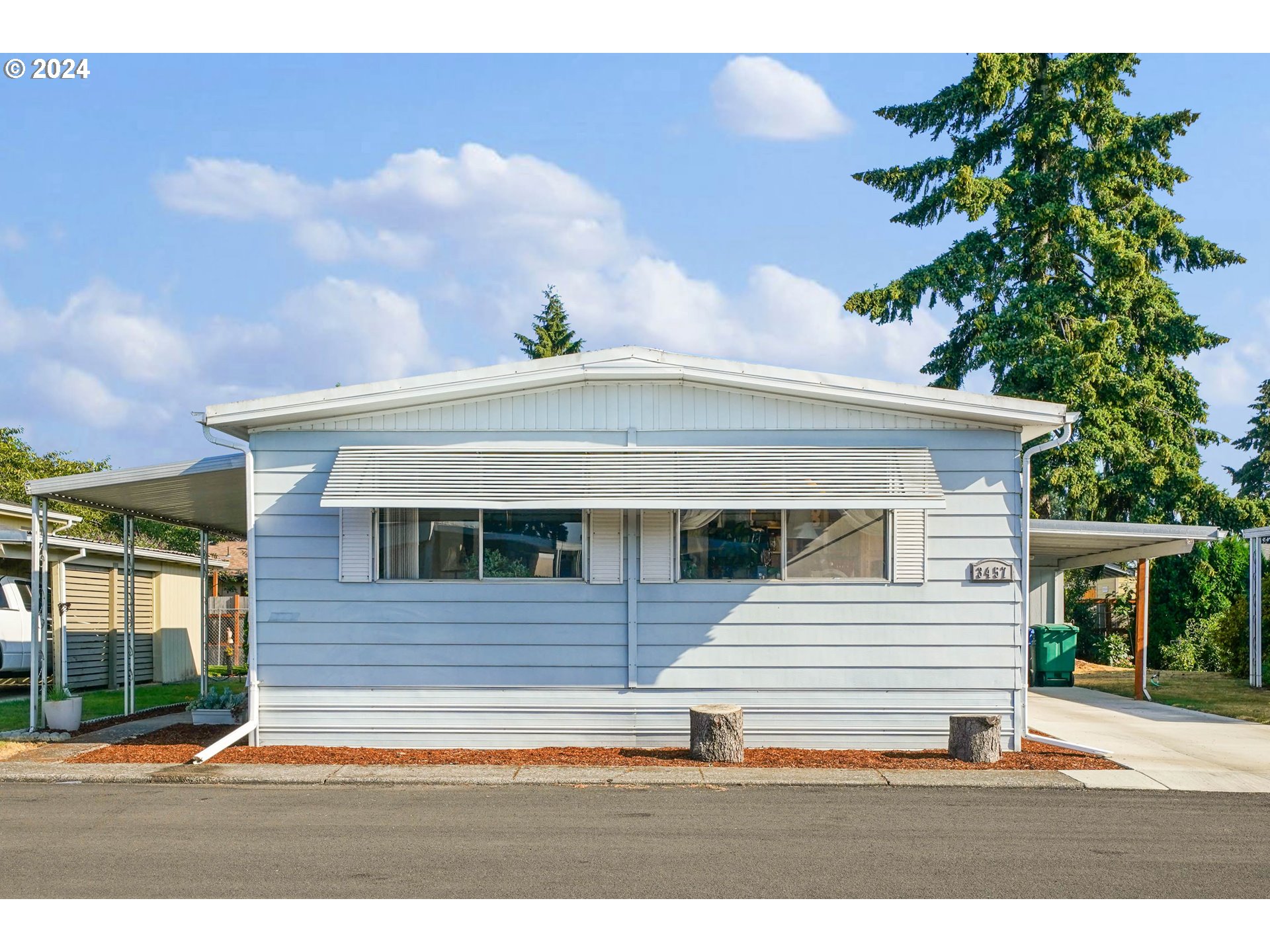 3457 Rainbow Loop Hubbard, OR 97032 - Photo 1 of 32 a white building with a clock on the side of it