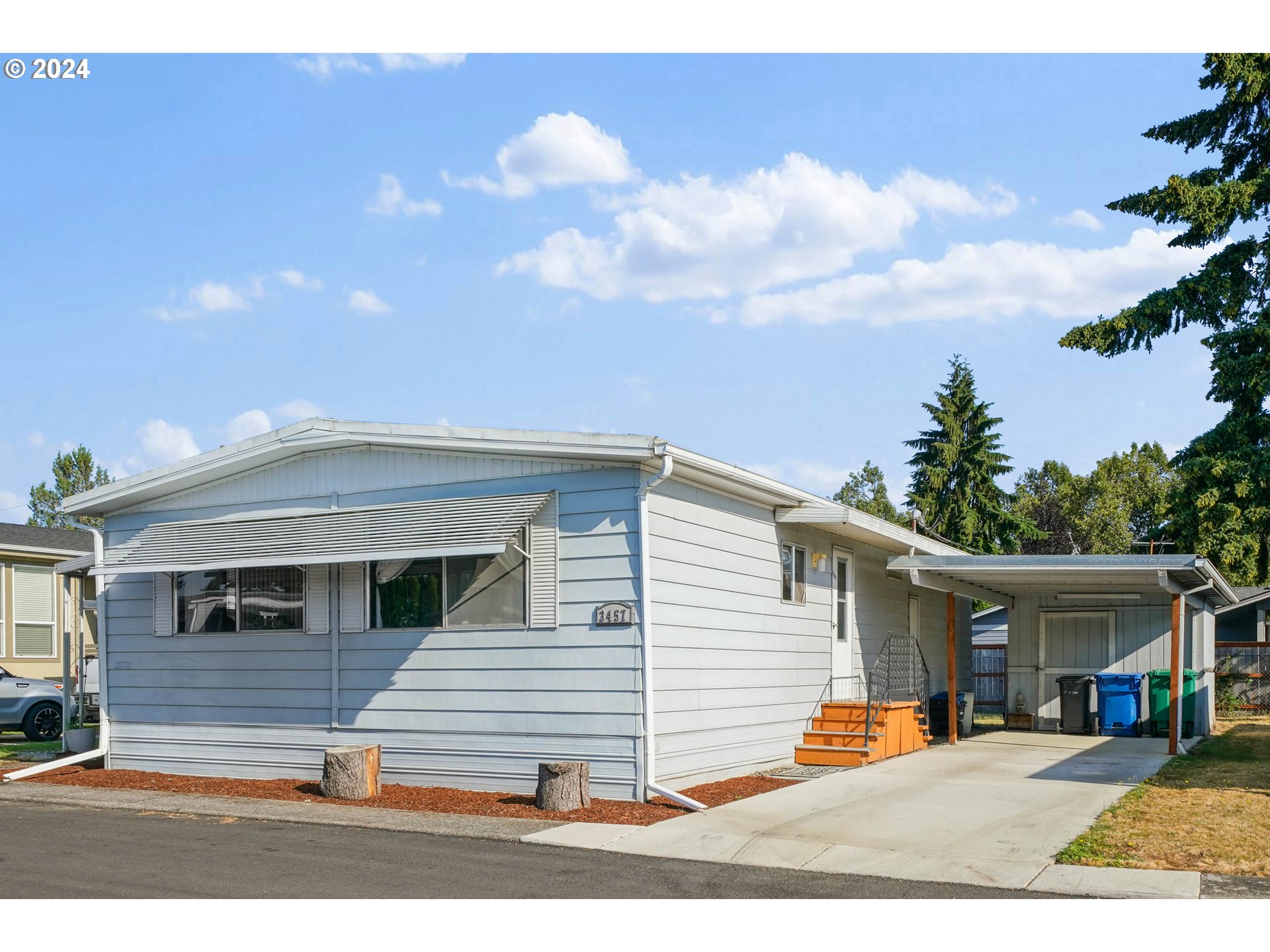 3457 Rainbow Loop Hubbard, OR 97032 - Photo 14 of 32 a view of a white house with a patio