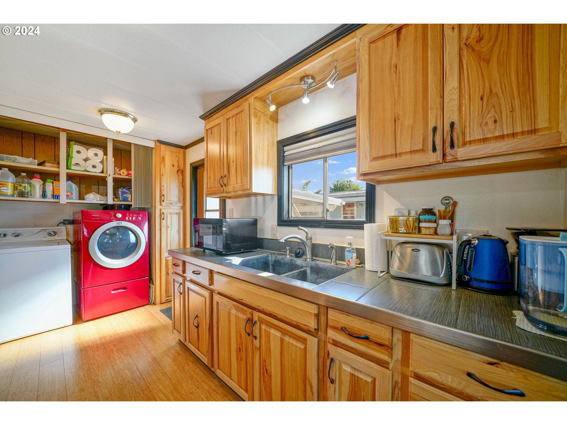 3457 Rainbow Loop Hubbard, OR 97032 - Photo 15 of 32 a kitchen with lots of appliances and cabinets