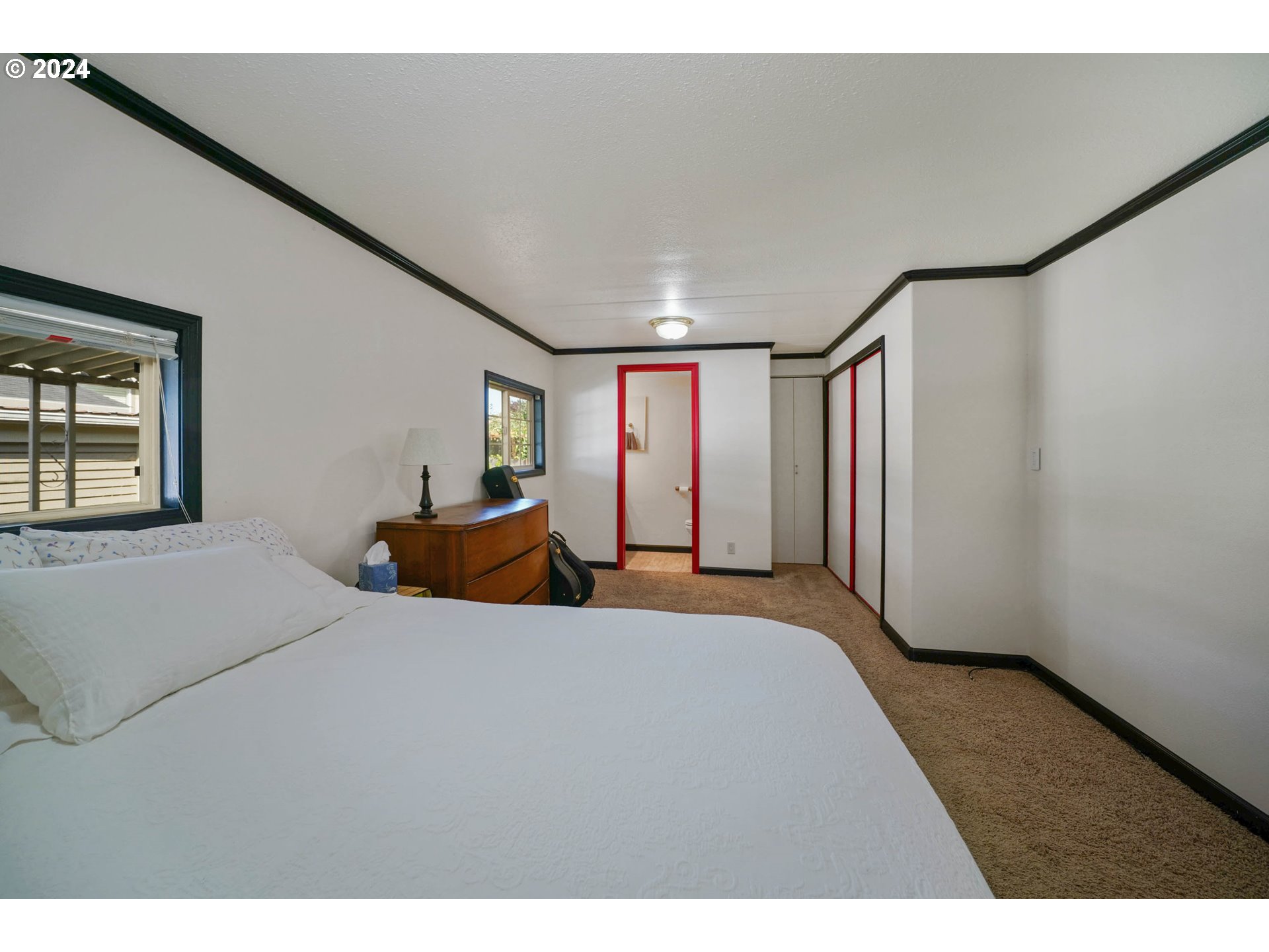 3457 Rainbow Loop Hubbard, OR 97032 - Photo 17 of 32 a bedroom with a large bed and a large window
