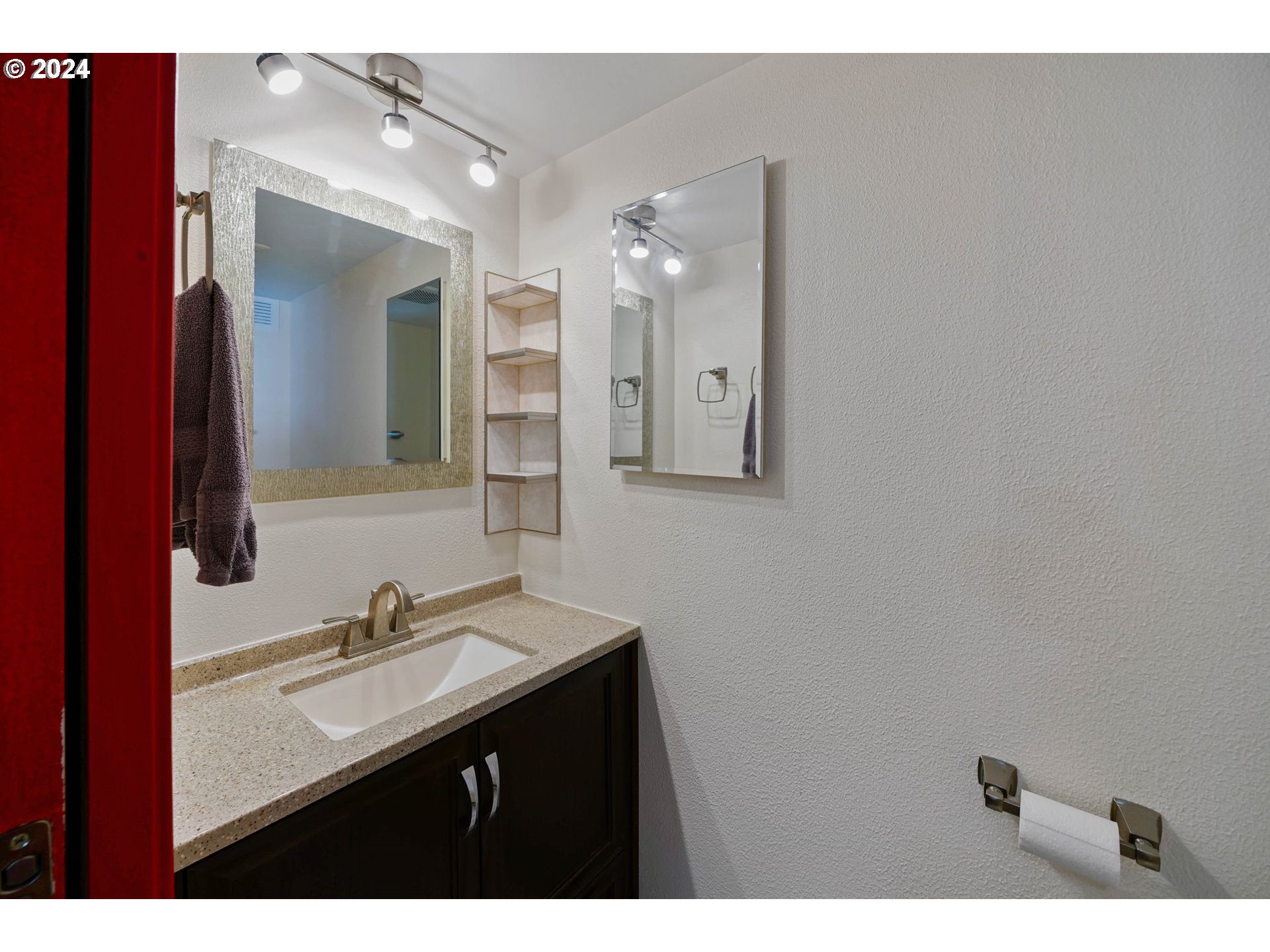 3457 Rainbow Loop Hubbard, OR 97032 - Photo 19 of 32 a bathroom with a sink and a mirror