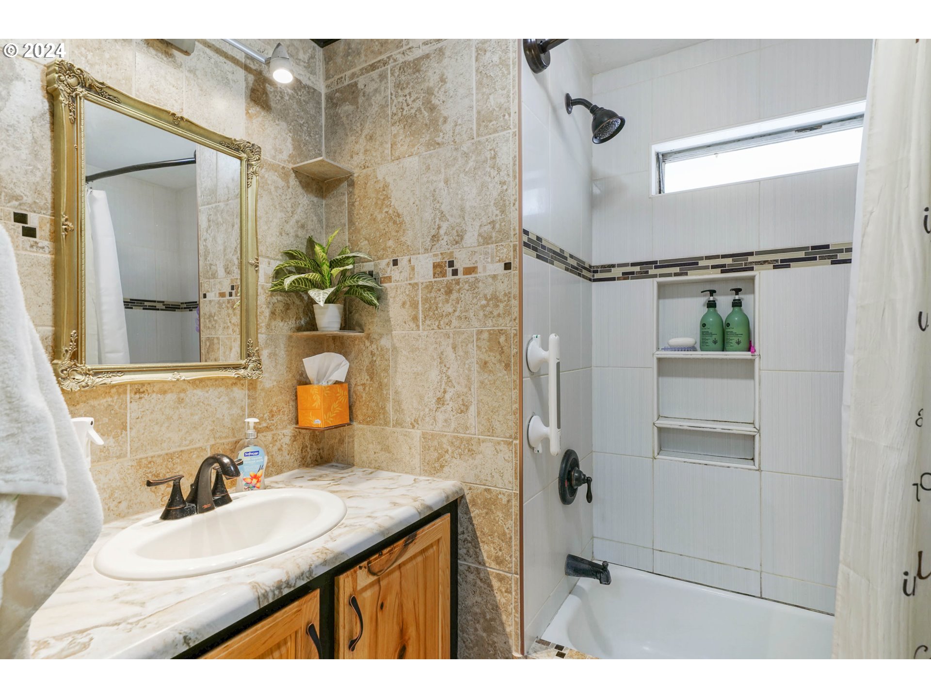 3457 Rainbow Loop Hubbard, OR 97032 - Photo 23 of 32 a bathroom with a granite countertop sink a mirror and a shower