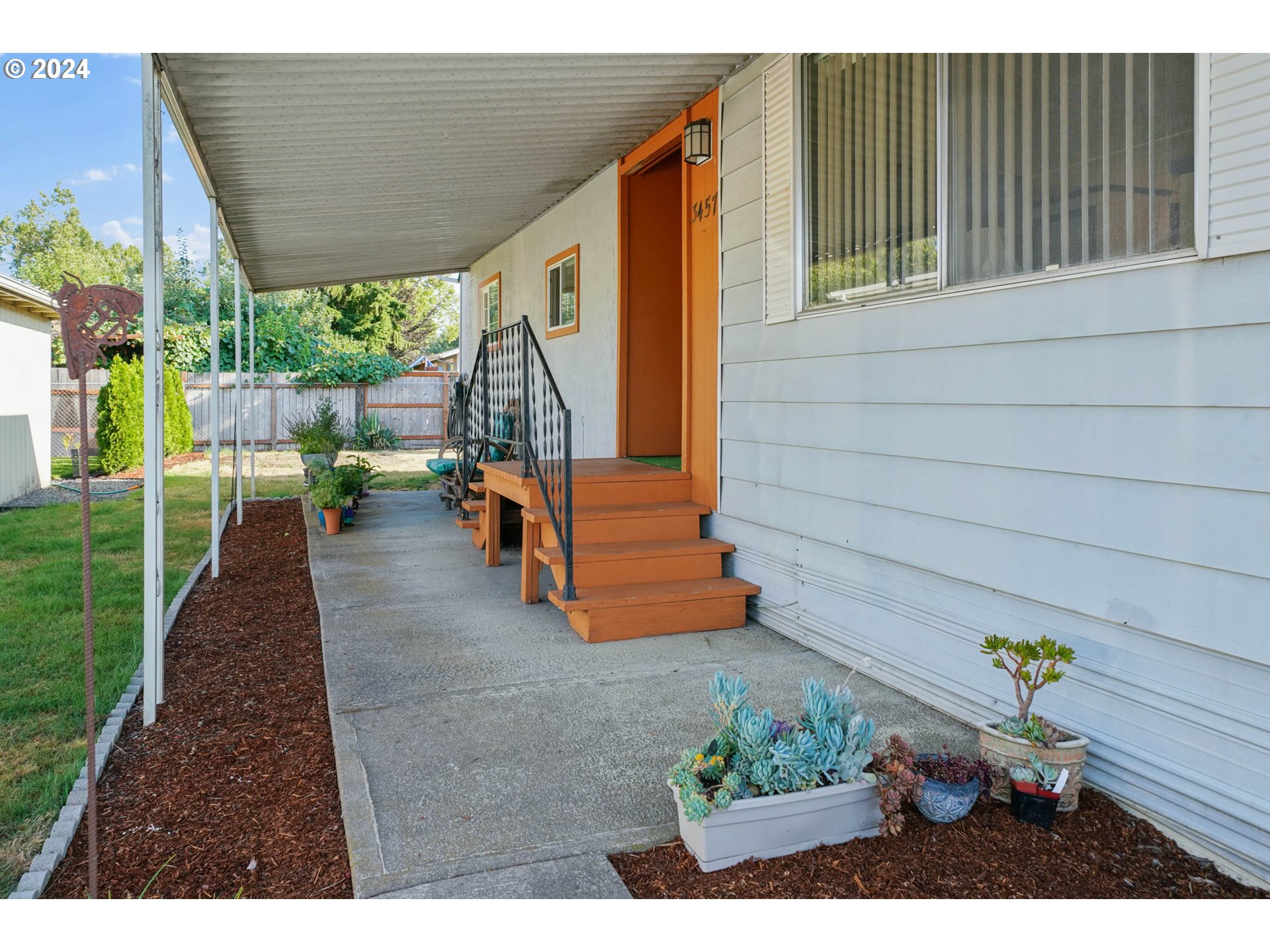 3457 Rainbow Loop Hubbard, OR 97032 - Photo 3 of 32 a backyard of a house with outdoor seating