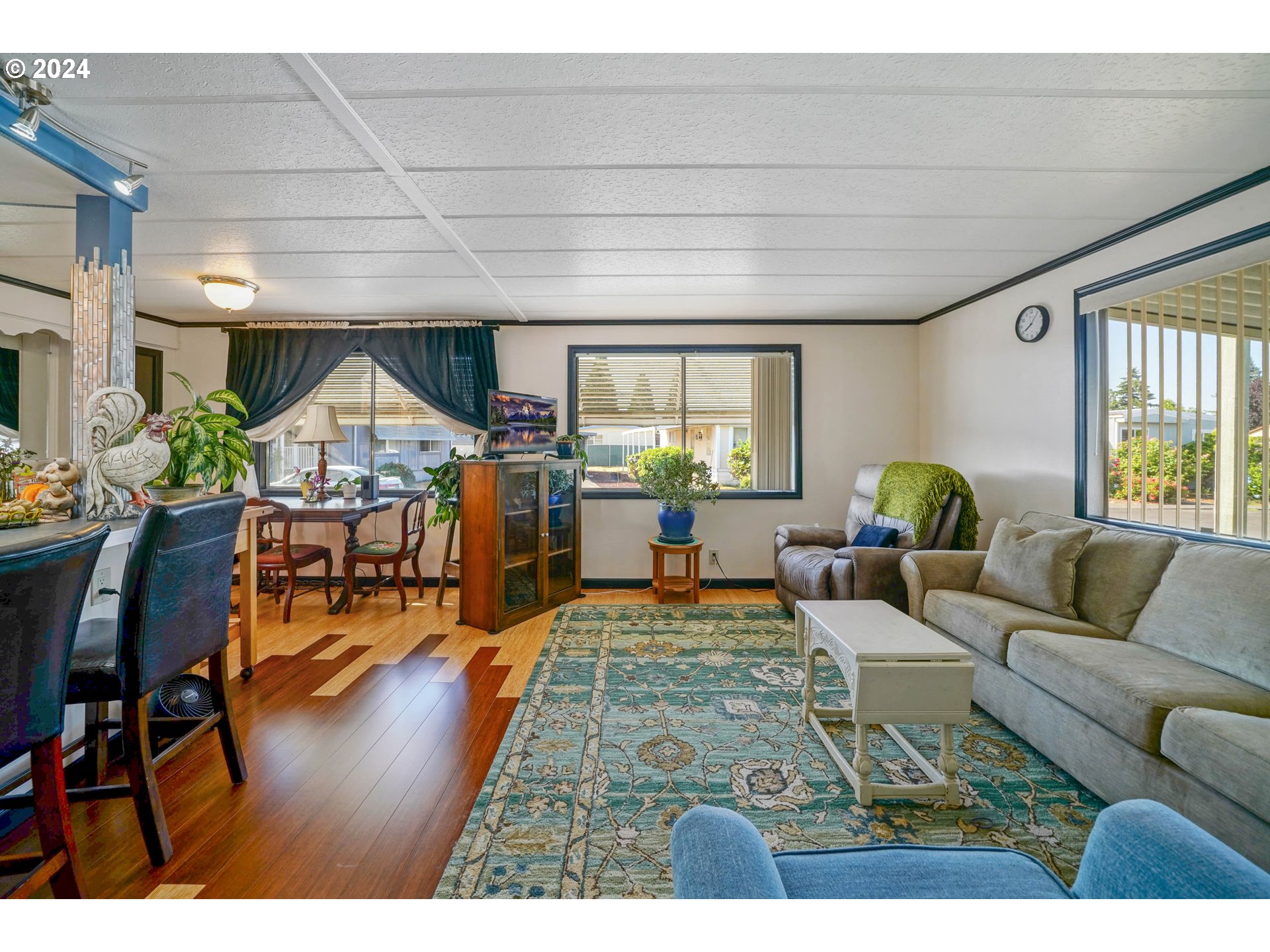3457 Rainbow Loop Hubbard, OR 97032 - Photo 5 of 32 a living room with furniture and a wooden floor