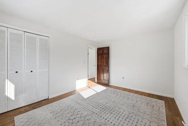 an empty room with wooden floor