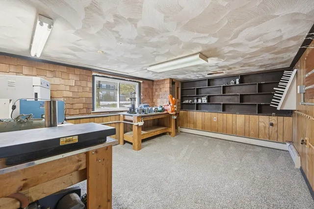 a room with pool table and flat screen tv