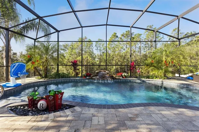 a view of a swimming pool with a patio