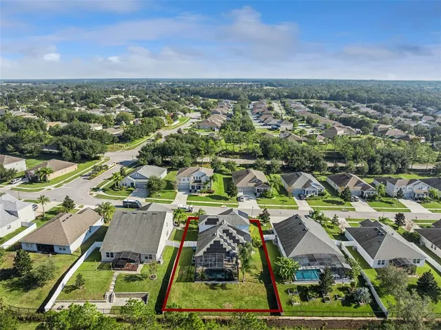an aerial view of a house with a garden