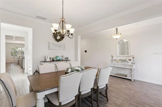 a kitchen with kitchen island granite countertop a center island a sink cabinets and stainless steel appliances