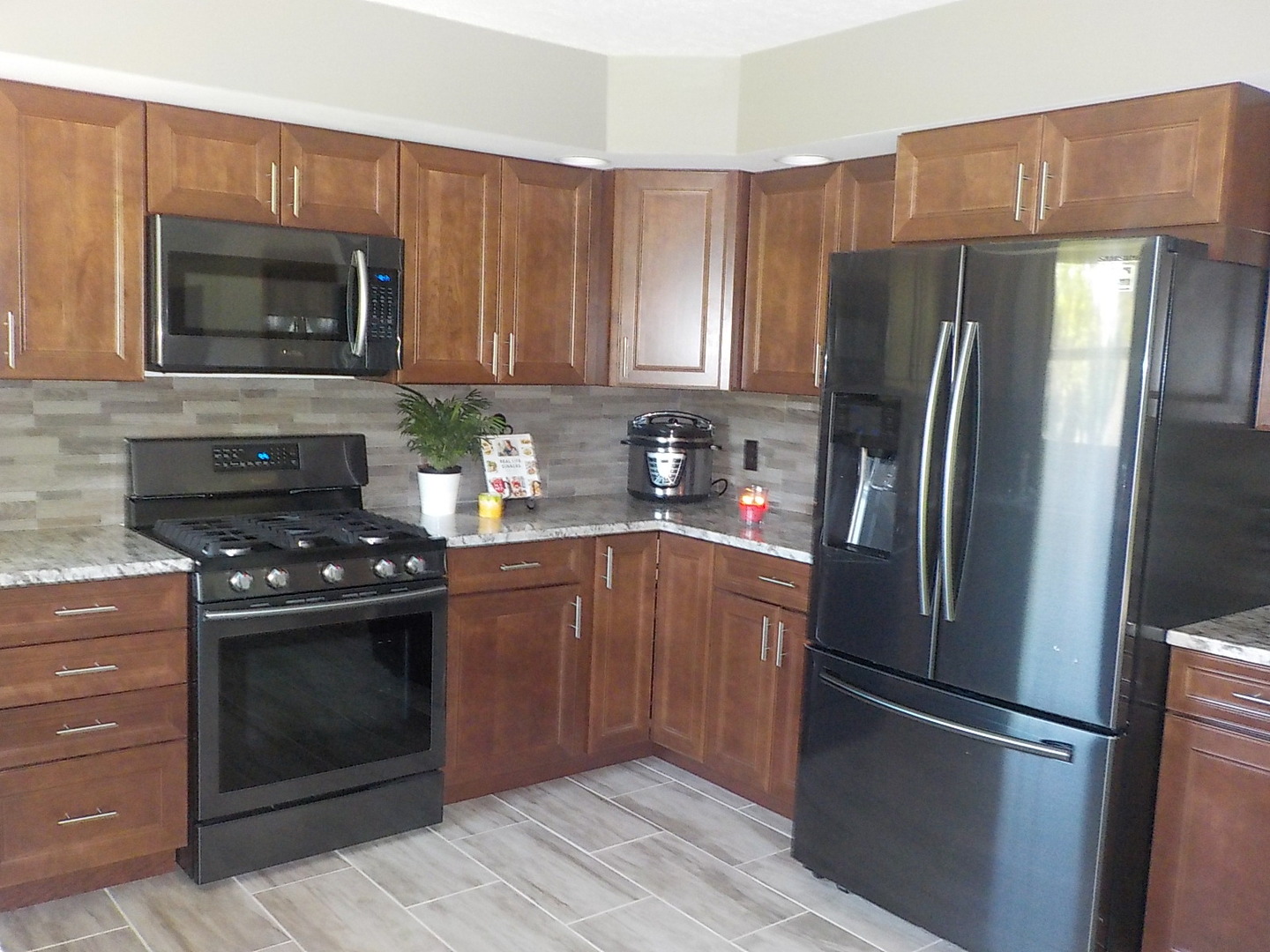 10144 Branch Road Rochelle, IL 61068 - Photo 4 of 38 a kitchen with stainless steel appliances granite countertop a refrigerator stove and microwave