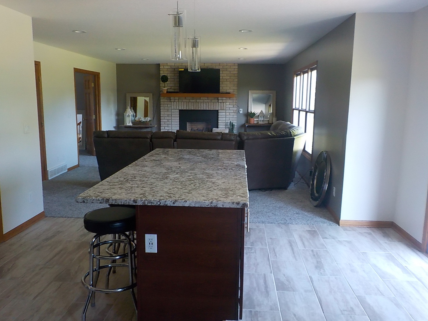 10144 Branch Road Rochelle, IL 61068 - Photo 5 of 38 a view of living room and kitchen with furniture wooden floor
