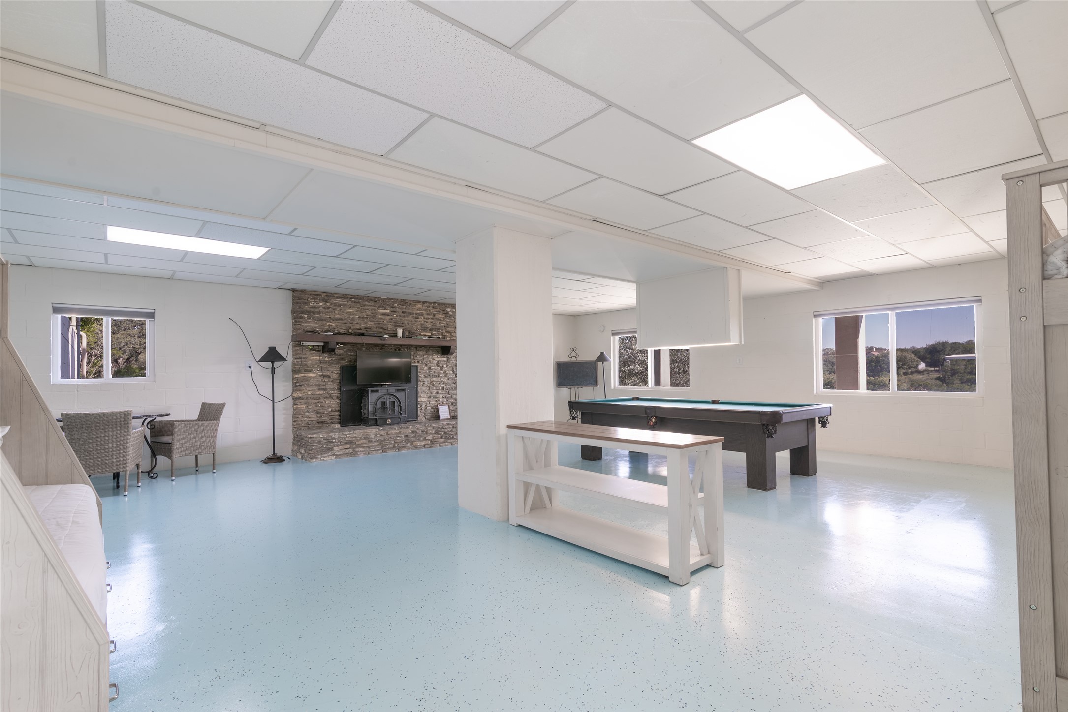 3807 Boat Dock Road Lago Vista, TX 78645 - Photo 20 of 37 A spacious lower-level recreation room offers ample space for entertainment and relaxation.
