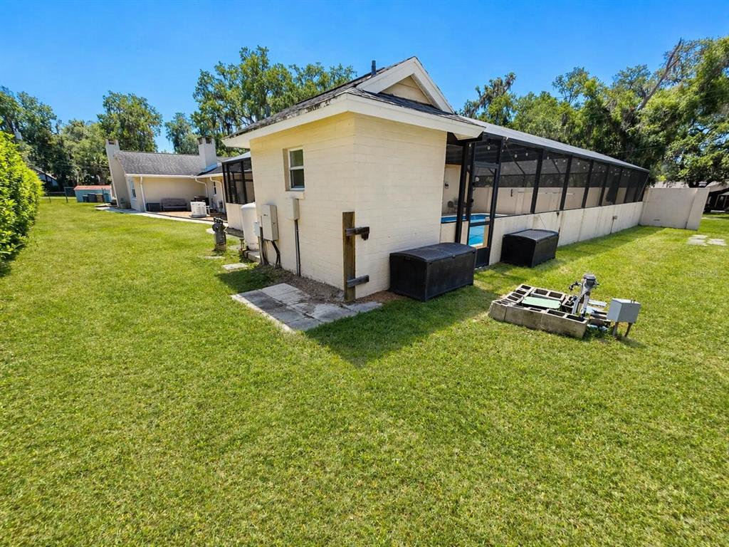 2313 Southeast 7th Street Ocala, FL 34471 - Photo 51 of 54 a view of a house with a yard