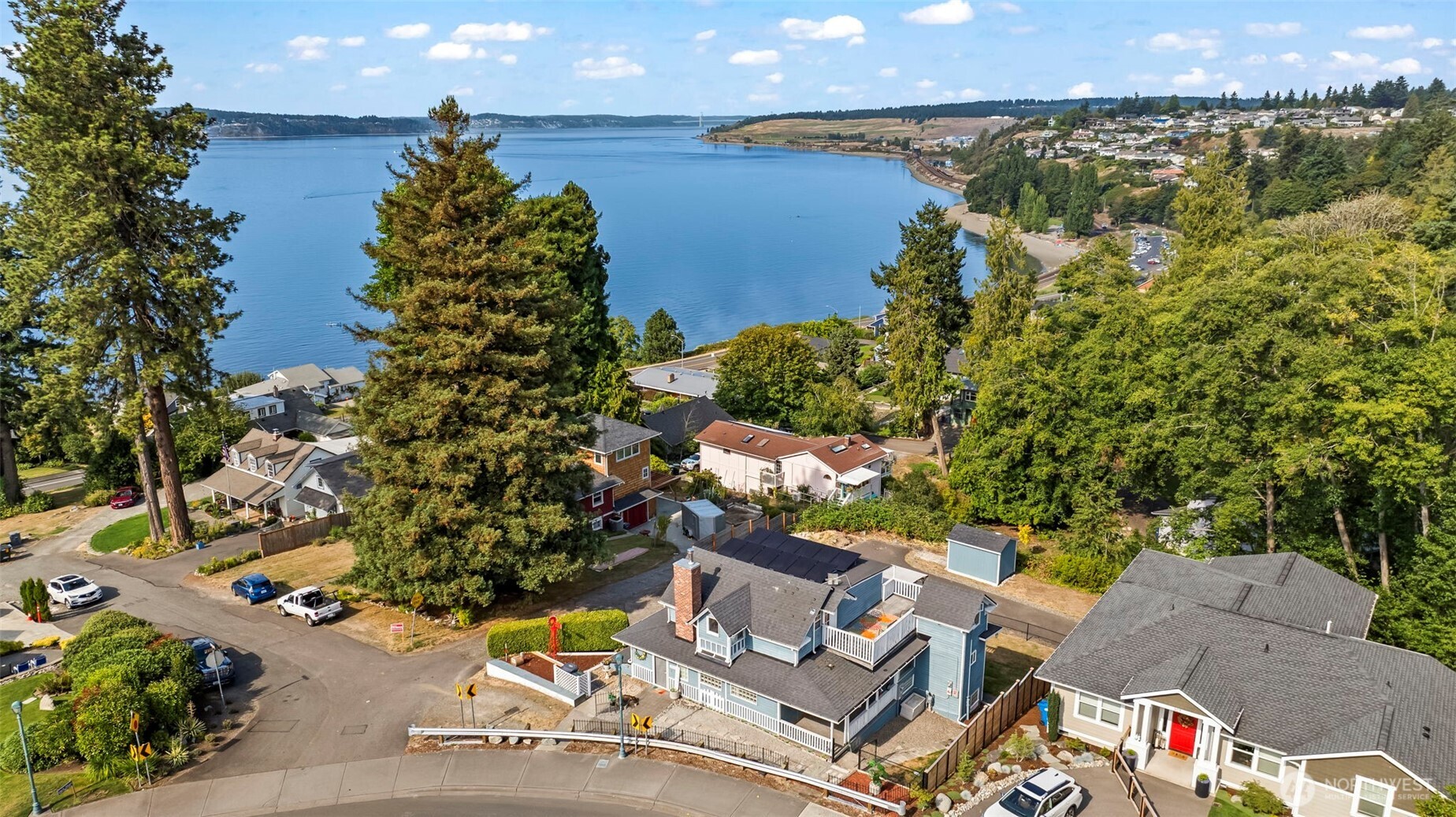 an aerial view of a house with a lake view