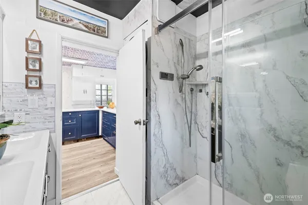 a bathroom with a shower and a tub