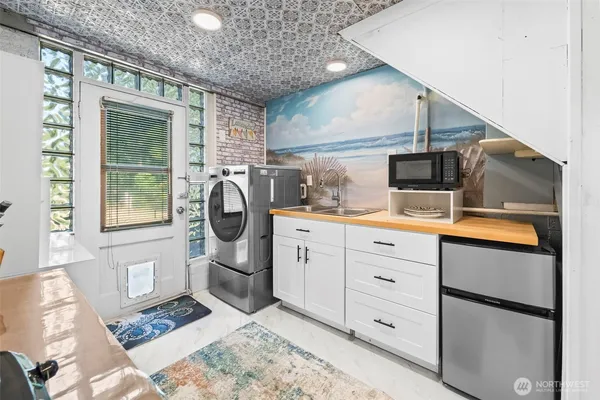 a kitchen with cabinets and window