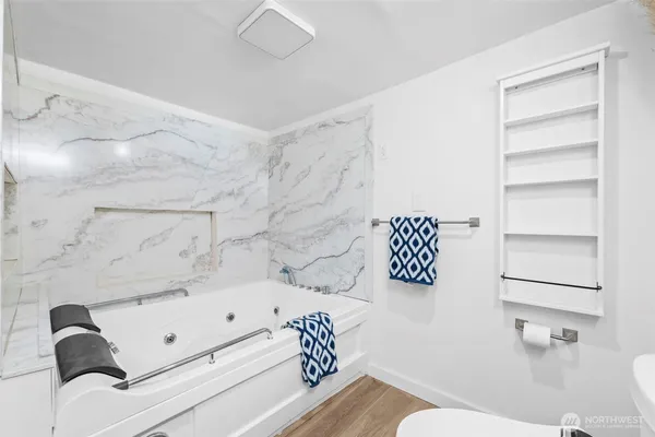 a bathroom with a bathtub and a shower