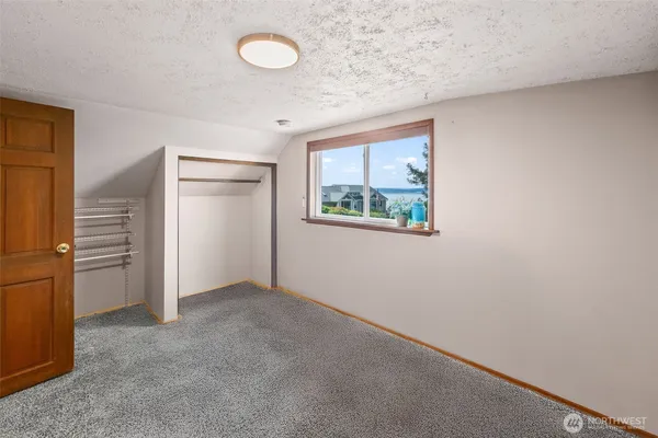a view of a hallway with seating area