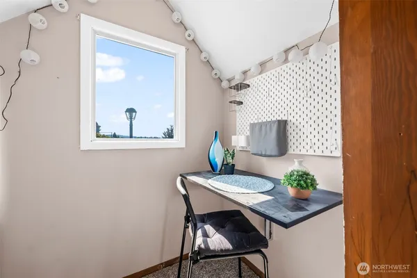 a bathroom with a granite countertop sink toilet a large mirror a shower and vanity