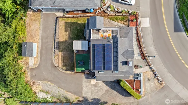 an aerial view of a house with a yard and garden