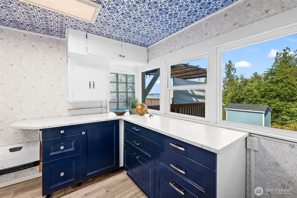 a bathroom with a sink vanity and mirror