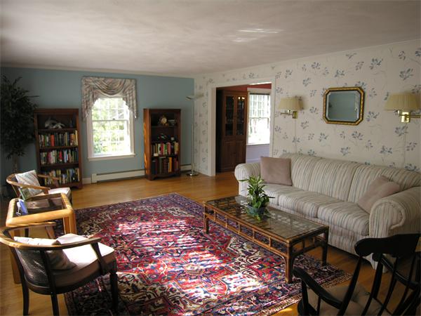 65 Stewart Road Needham, MA 02492 - Photo 5 of 30 a living room with furniture and a flat screen tv