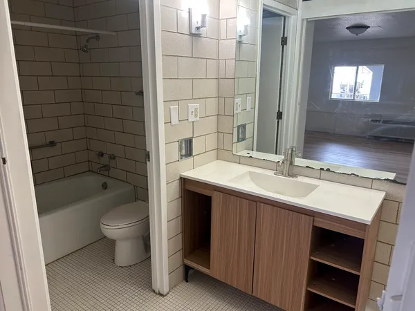 a bathroom with a toilet and bathtub
