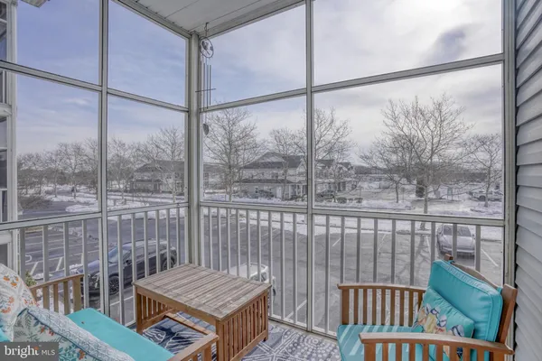a view of a balcony with floor to ceiling window