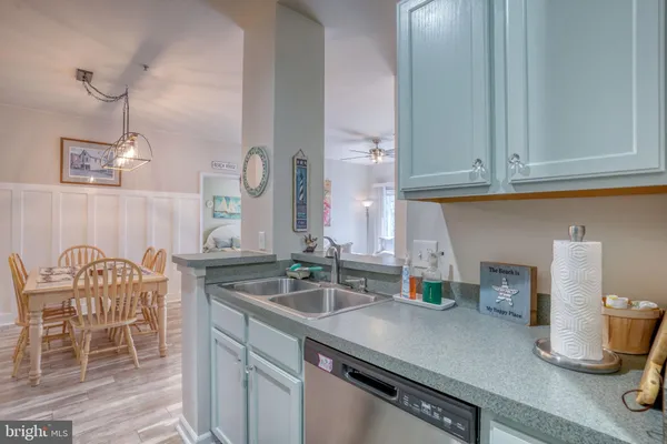 a kitchen with a sink cabinets and window