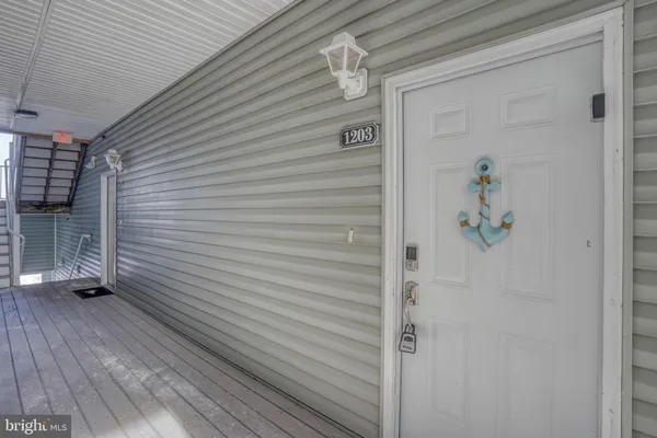 a view of a door and wooden floor