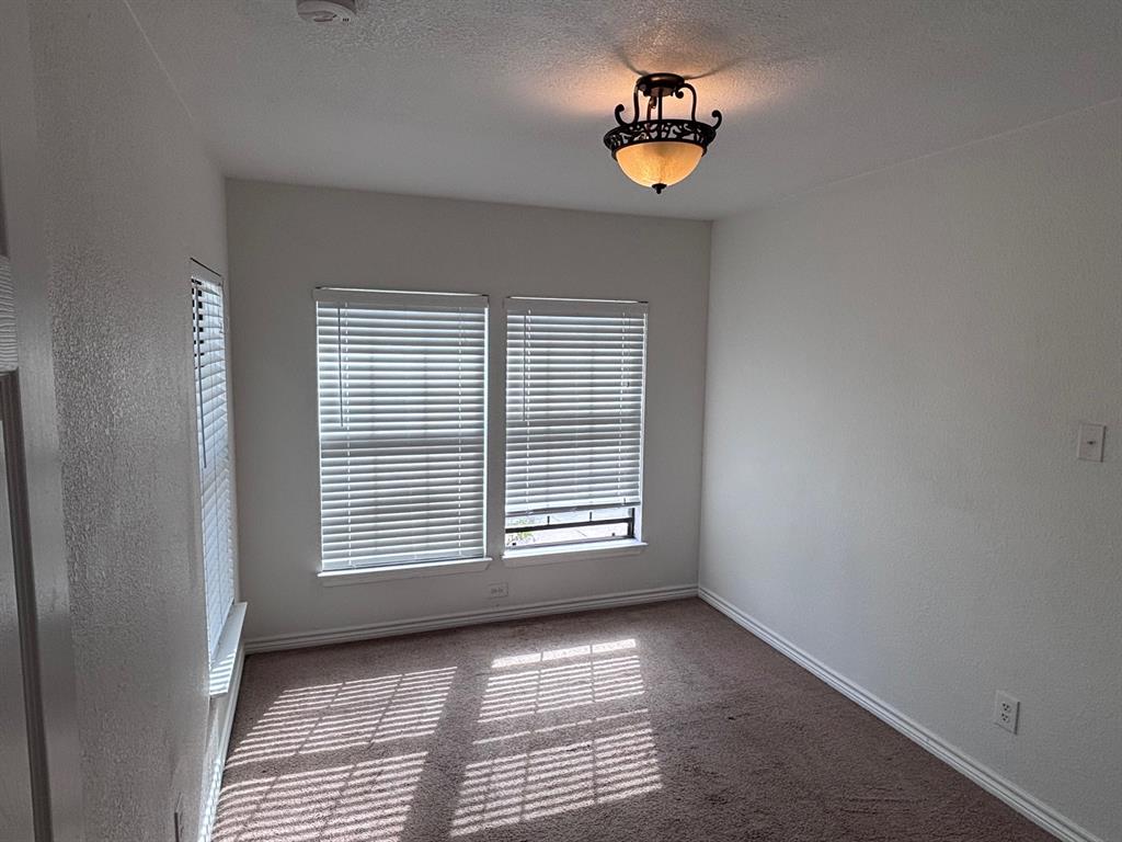 5003 Bryan Street, Unit 8 Dallas, TX 75206 - Photo 11 of 13 a view of an empty room with a window