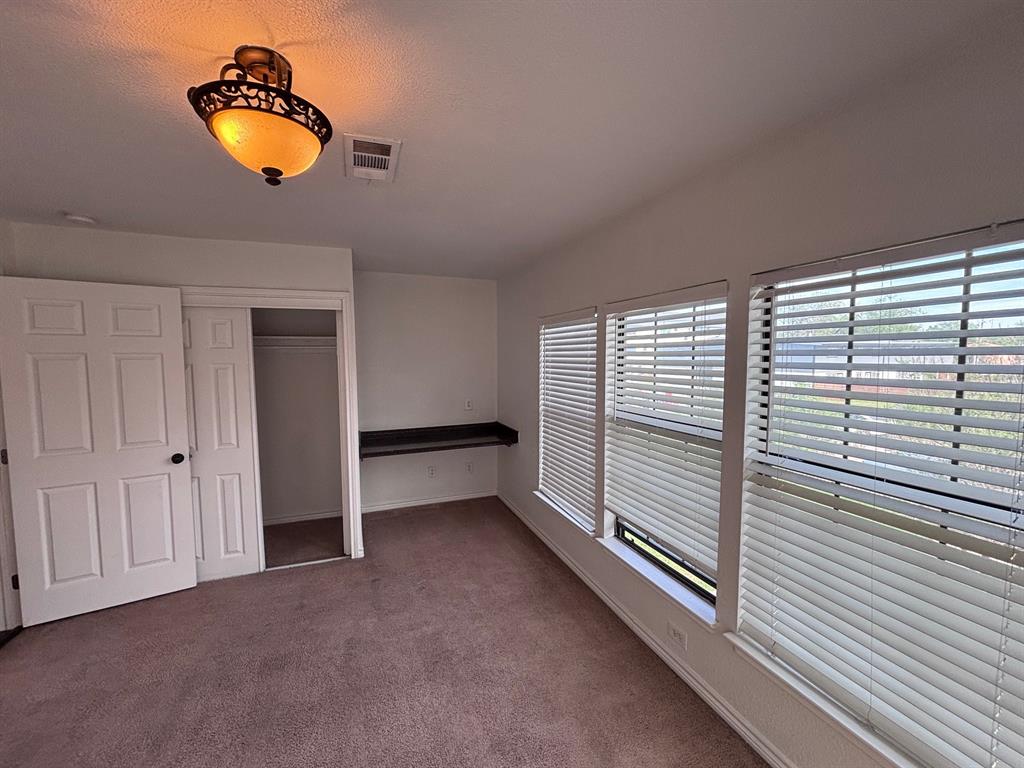 5003 Bryan Street, Unit 8 Dallas, TX 75206 - Photo 6 of 13 a view of an empty room with a window