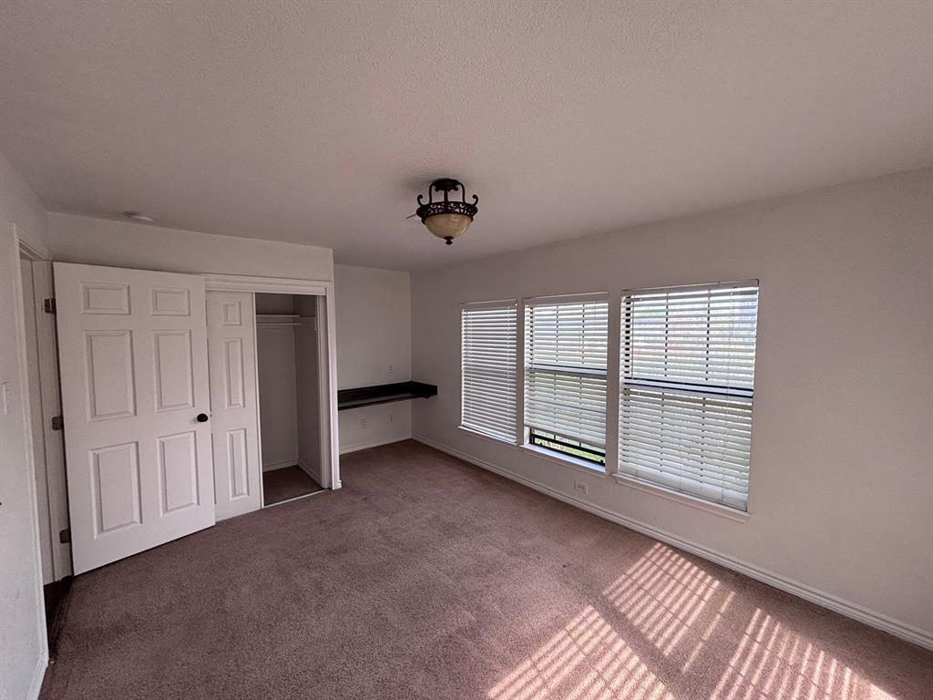 5003 Bryan Street, Unit 8 Dallas, TX 75206 - Photo 7 of 13 a view of an empty room with a window