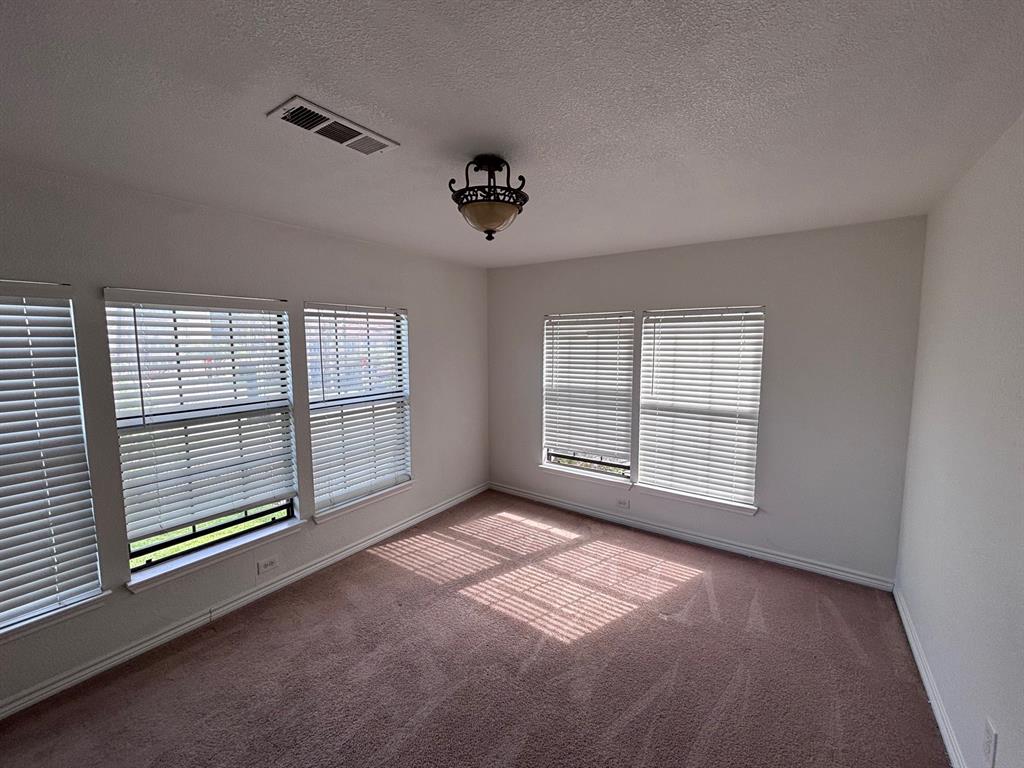 5003 Bryan Street, Unit 8 Dallas, TX 75206 - Photo 8 of 13 a view of an empty room with a window