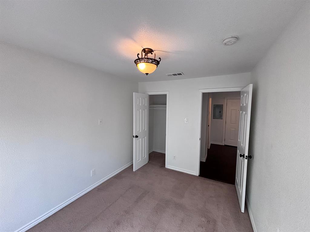 5003 Bryan Street, Unit 8 Dallas, TX 75206 - Photo 9 of 13 a view of an empty room with a window