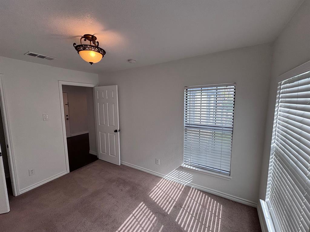 5003 Bryan Street, Unit 8 Dallas, TX 75206 - Photo 10 of 13 a view of an empty room with a window