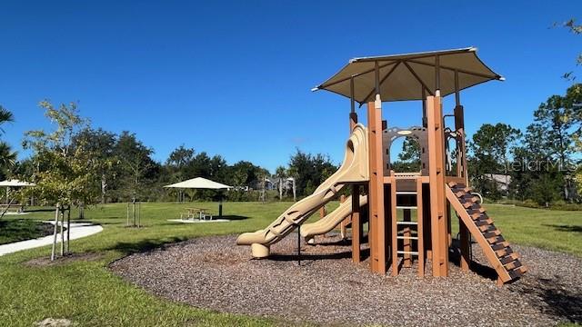 2792 Mdw Strm Way Clermont, FL 34714 - Photo 18 of 20 a view of a house with a yard