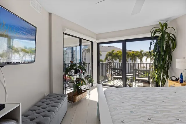 a very nice looking room with a large window and storage