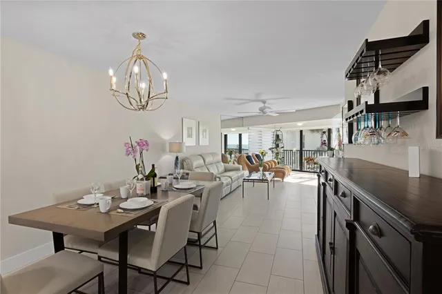 a view of a dining room with furniture and chandelier