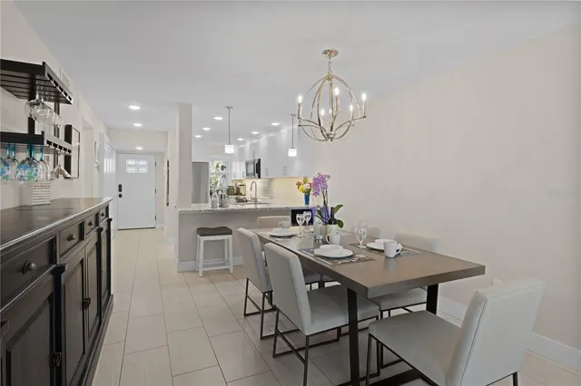 a kitchen with a table and chairs in it