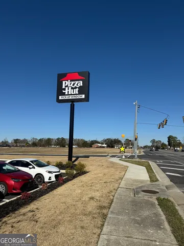 a view of a street with an ocean view