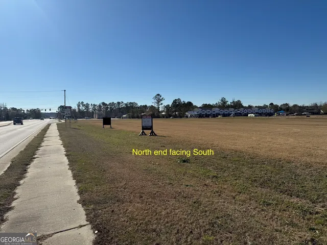 a view of a lake with houses in front of it