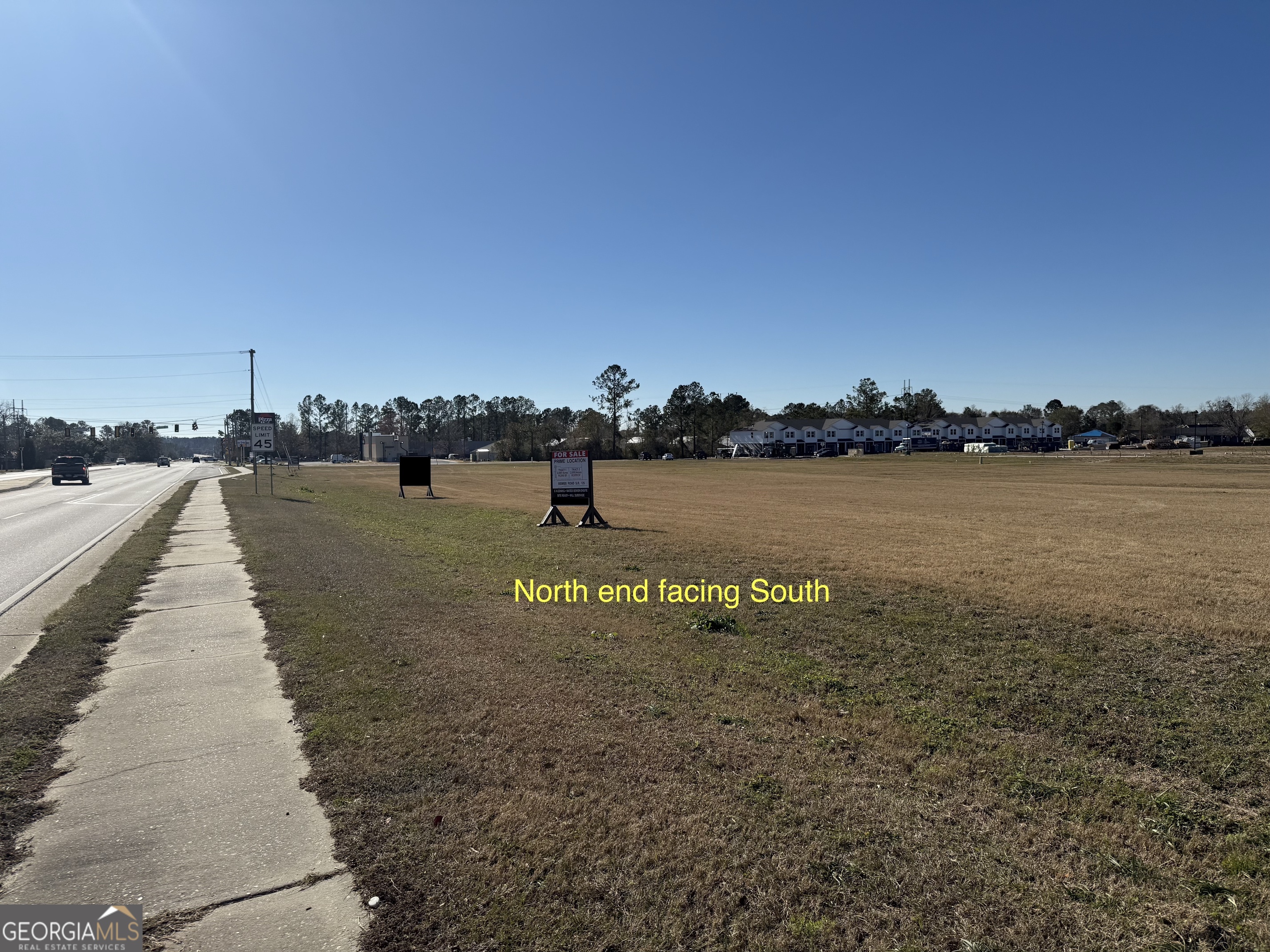 4475 Bemiss Road Valdosta, GA 31605 - Photo 6 of 12 a view of a lake with houses in front of it