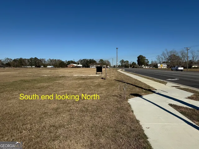 a view of a street with an ocean view