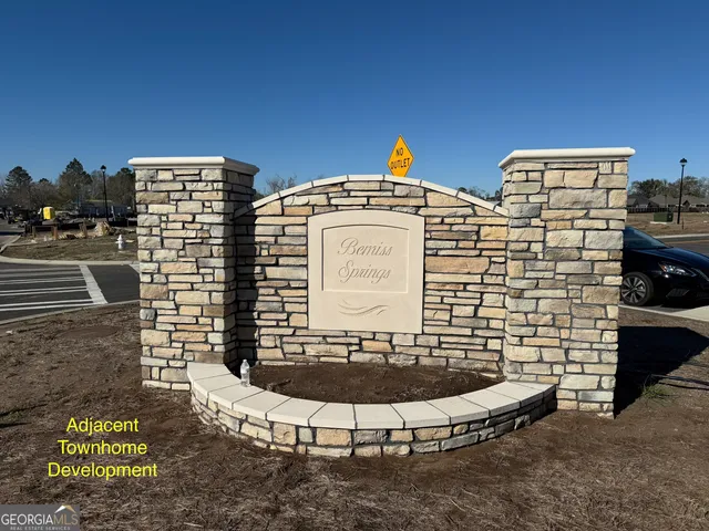 a view of a building with car parked